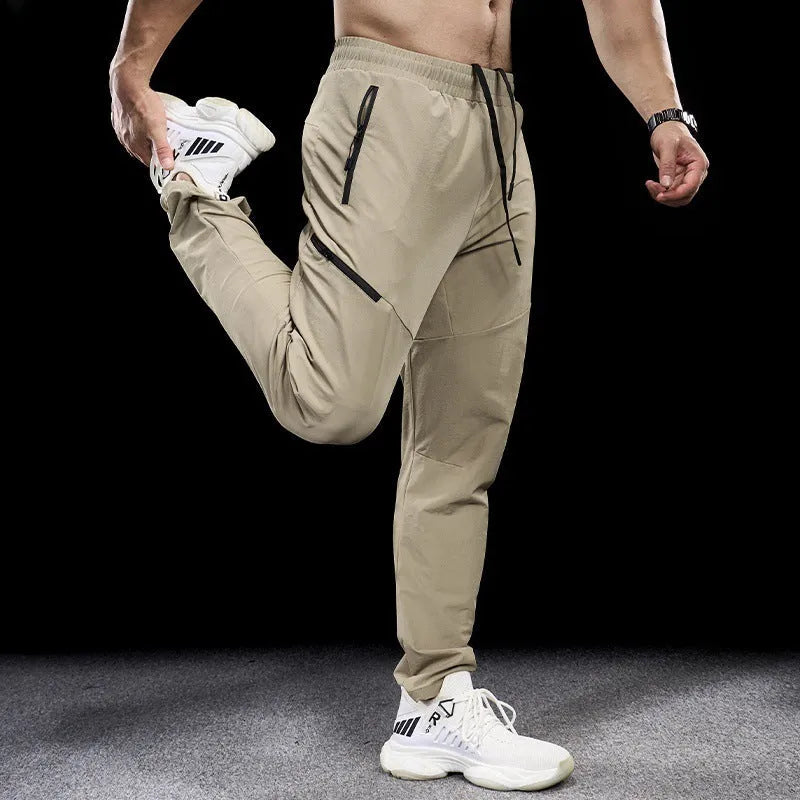 Men's waterproof quick-drying nylon exercise trousers in Army Green colour with mid waist design
