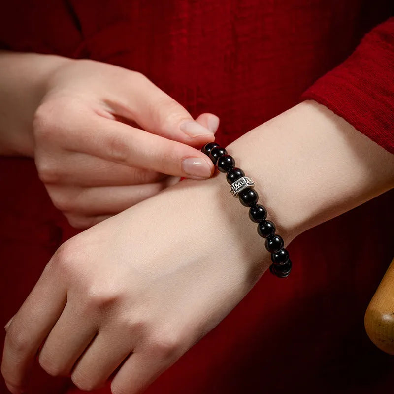 Obsidian bracelet with carved Chinese zodiac animal design, ethnic style, 8mm thick.