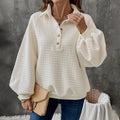 Women's milky white textured polo collar thick knit sweater on a hanger