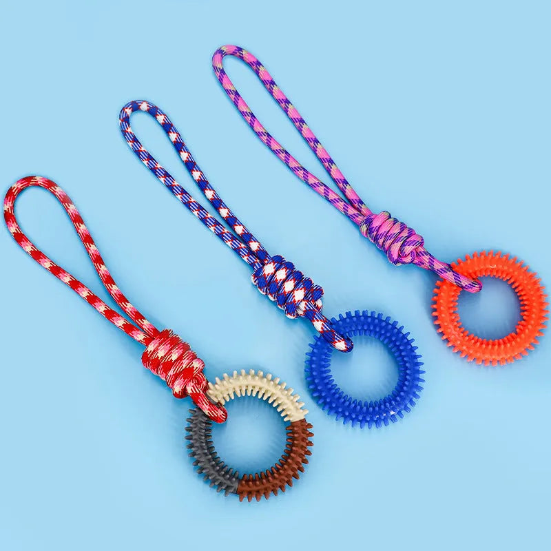 Blue braided rope dog toy with a central knot, shown next to a red and rose red version.