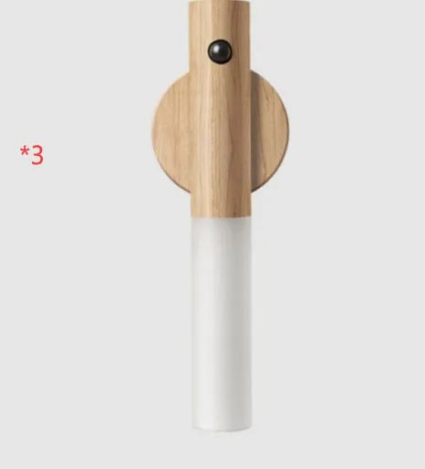 Smart sensor LED desk lamp in solid wood and organic glass with automatic motion activation.