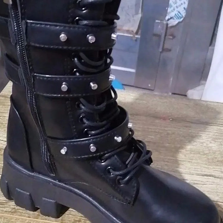 Women's black mid-calf knight boots with side zip and metal buckle details on artificial PU upper