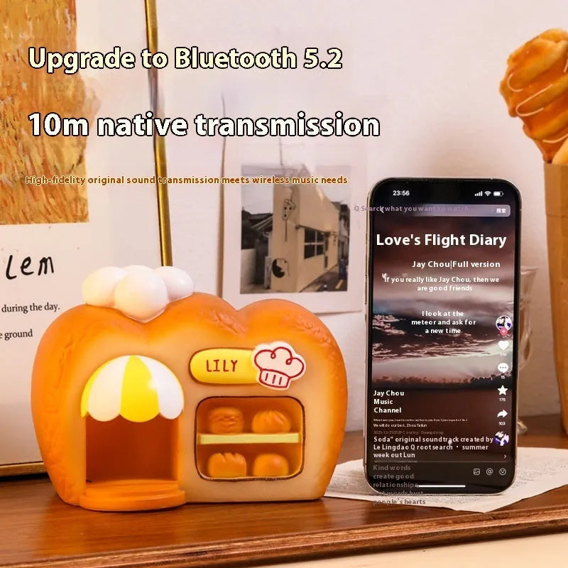 White ABS bakery Bluetooth speaker with glowing bread-shaped design, 155x90x115mm, FM/TF/USB/TWS modes
