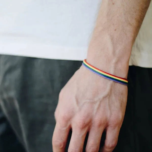 Rainbow pride bracelet with six braided wax cotton cords and silver-toned lobster claw clasp, unisex one size