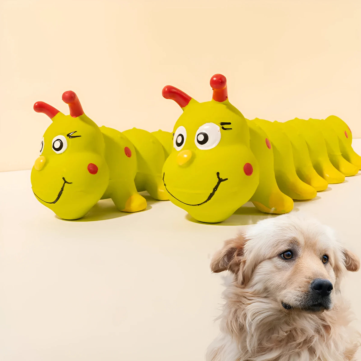 Yellow rubber caterpillar-shaped dog squeaky chew toy on a white background