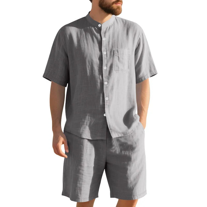 Men's light blue linen blend summer suit with short sleeve shirt jacket and matching shorts on a hanger.