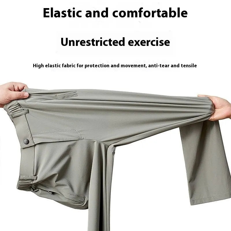 Man wearing black Ice Silk straight loose fit casual trousers with an elastic waistband.