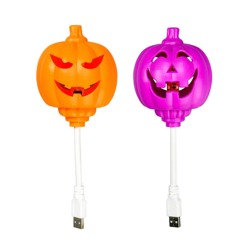 Plastic pumpkin lamp with USB cable showing yellow and purple light options