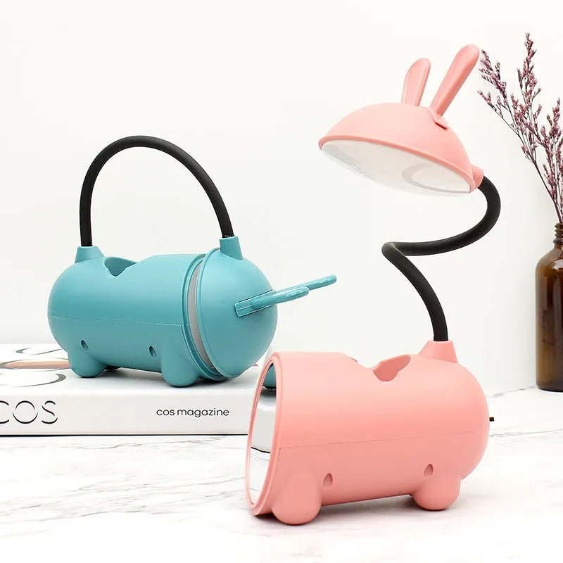 Cartoon-style USB-powered table lamp with pen container in green, blue, or pink colour