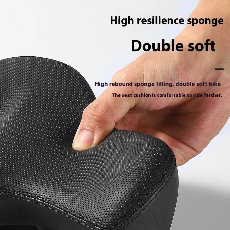 Black leather bicycle saddle cushion with polyurethane foam padding shown on a bicycle seat