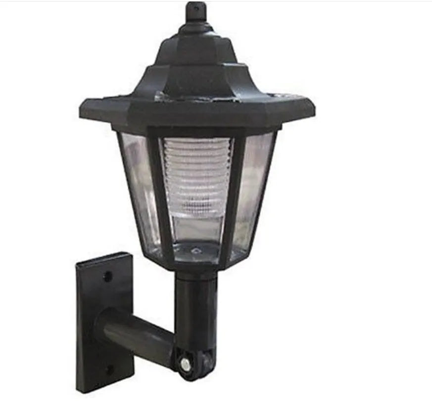 Black hexagonal solar-powered outdoor wall light with visible solar panel.