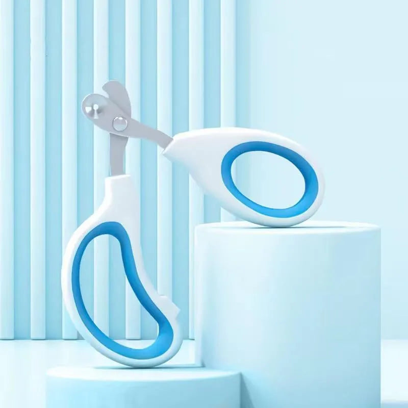 Blue pet nail clippers with circular cutting hole and cushioned non-slip handle for cats and small animals.