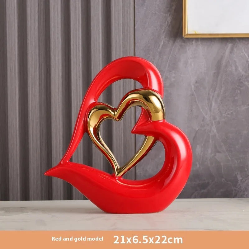 Modern white porcelain Love Heart ornament with a geometric design in a metallic gold finish.