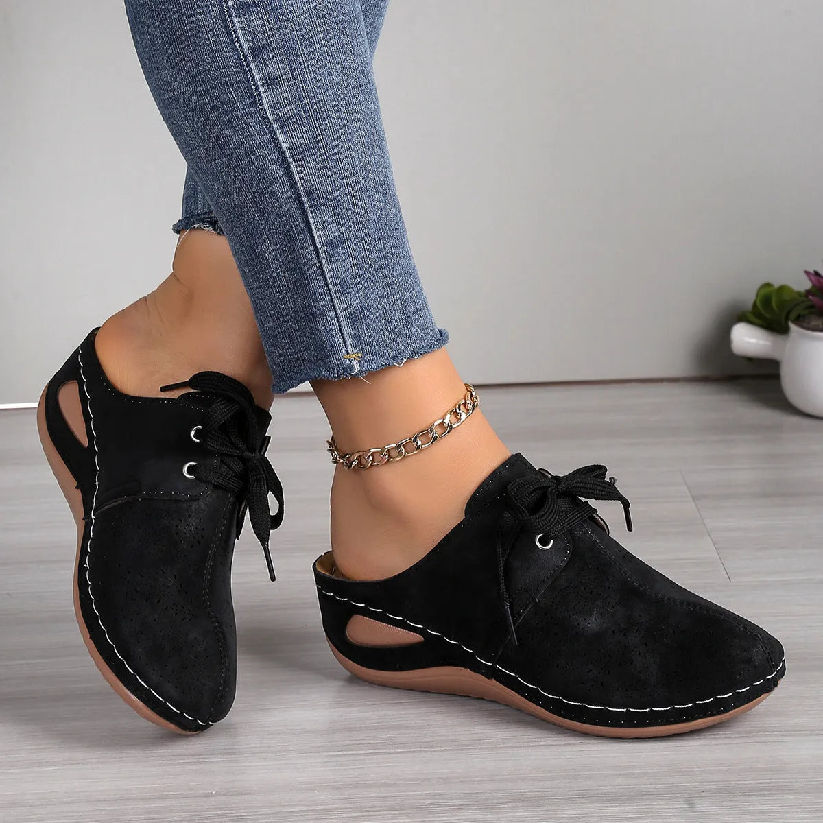 Women's lace-up summer slippers with suede upper, wedge heel, and rubber sole in various colours.