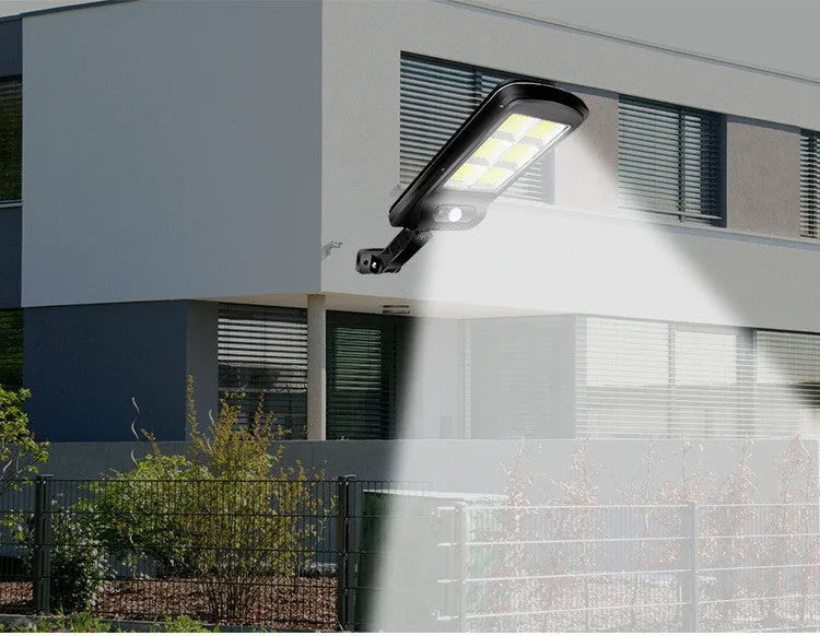 Black solar-powered motion sensor street light for outdoor garden and driveway security lighting