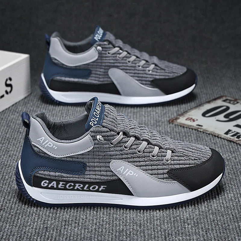 Men's grey and green low-top mesh running shoes with lace-up front.