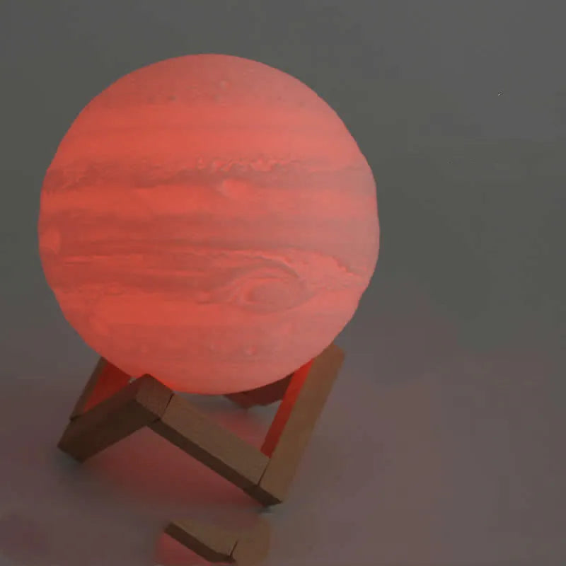3D printed white moon lamp on a wooden stand with touch control ring at base