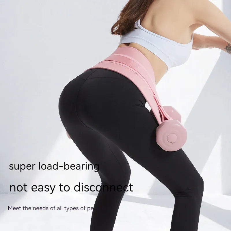 Black hip bridge training belt worn during dumbbell exercise