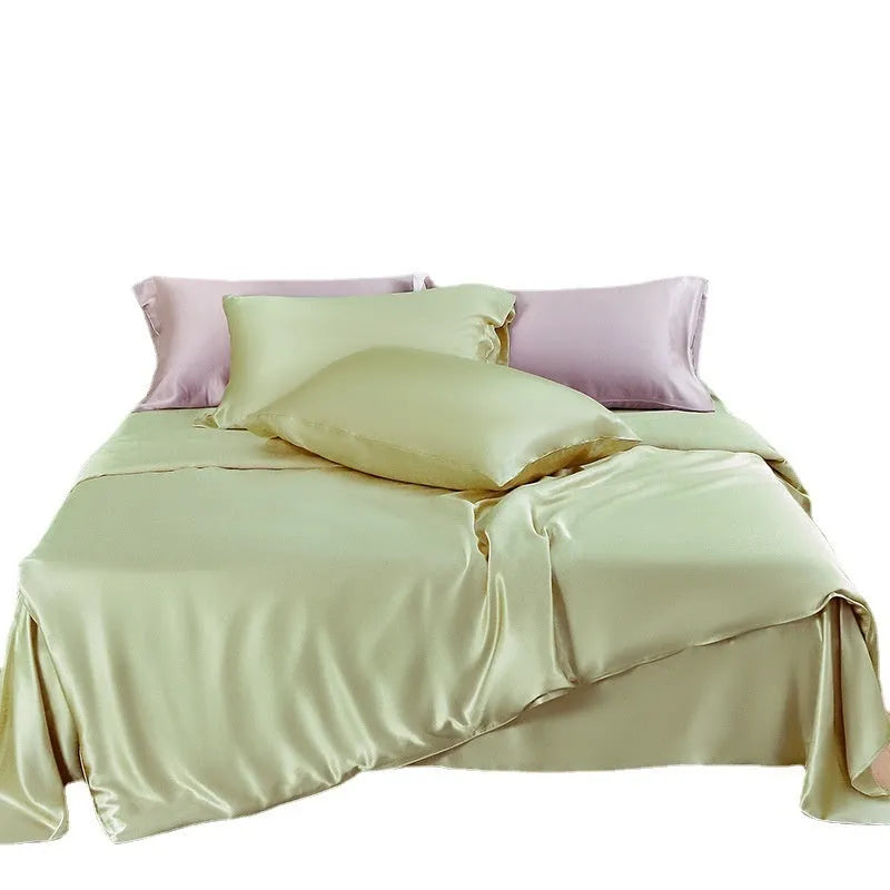 Double-sided silk duvet cover showing reversible solid colours in lotus pink and pea green options