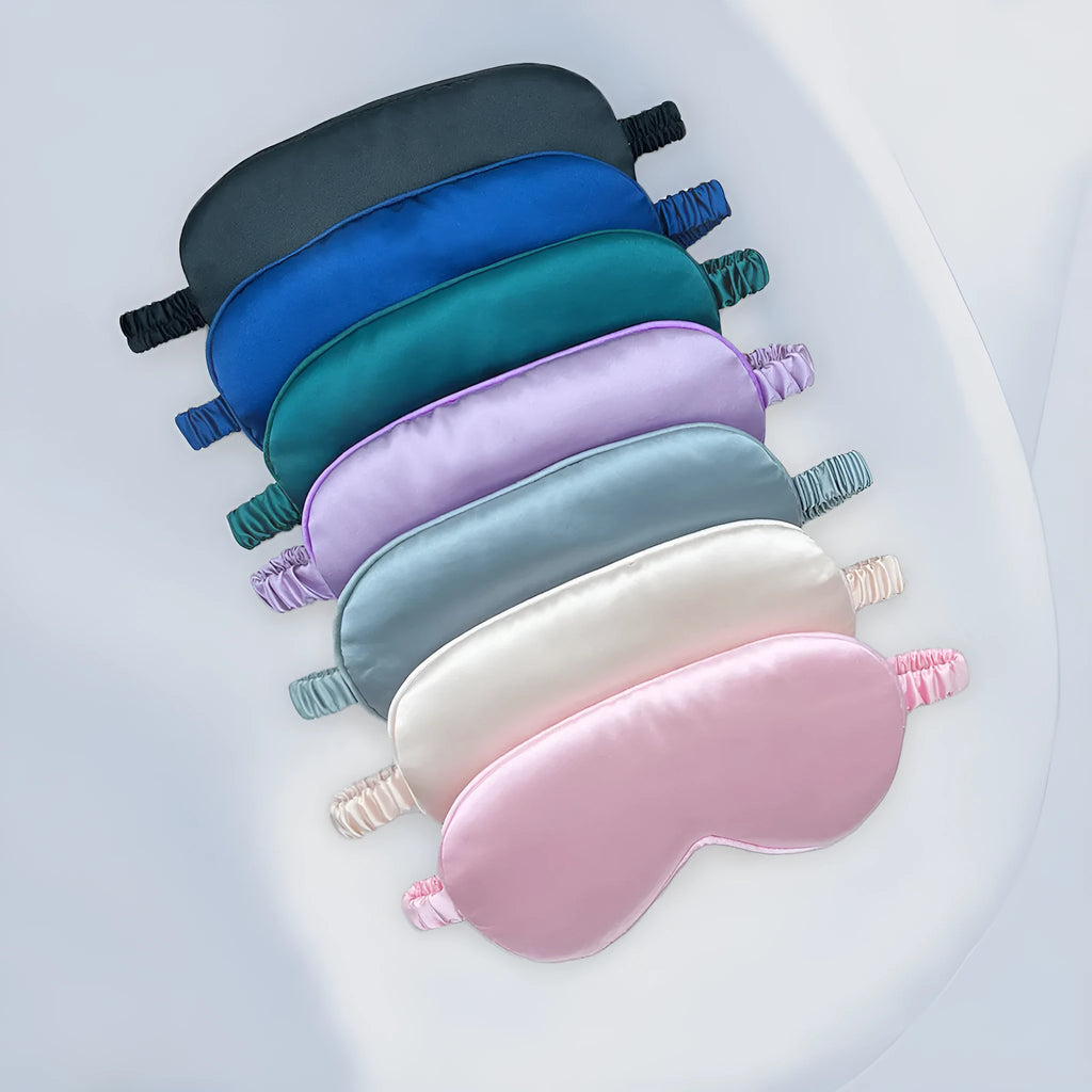 Double-sided silk-like eyeshade mask in rayon elastic satin showing multiple colour options.