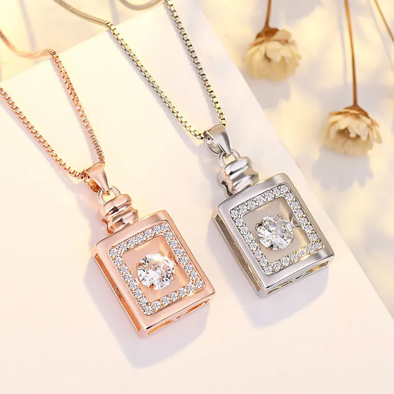 Sterling silver heart-shaped pendant necklace with crown and bow detail in rose gold or silver finish