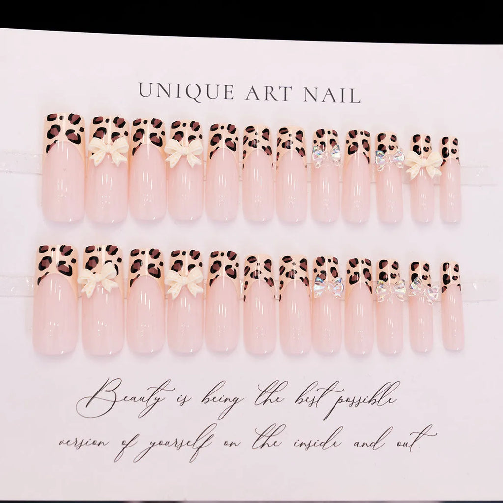 Leopard print false nails with butterfly decorations in colour WM296