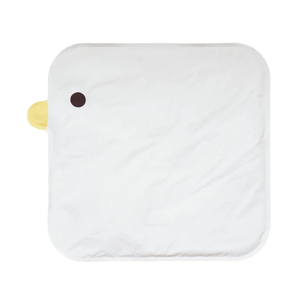 Square chick-shaped blue pet cooling mat on a wooden floor.