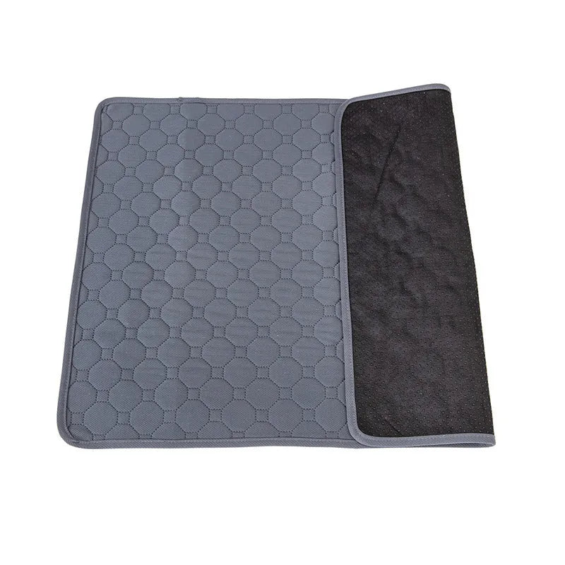 Washable dog pee pads in neutral tan and grey colours measuring 18x24 inches