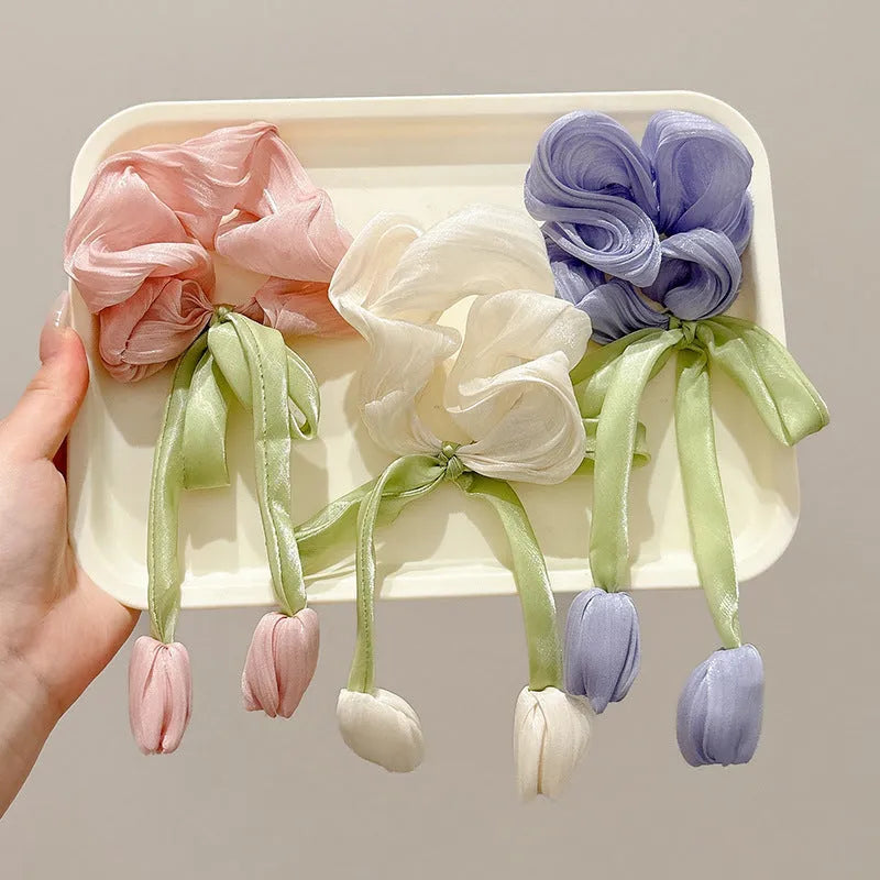 Children's knitted fabric headband with tulip element in Korean style, shown in beige, pink or purple colour option
