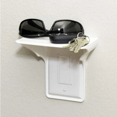 White plastic socket storage rack organiser for workshop tools on a workbench.