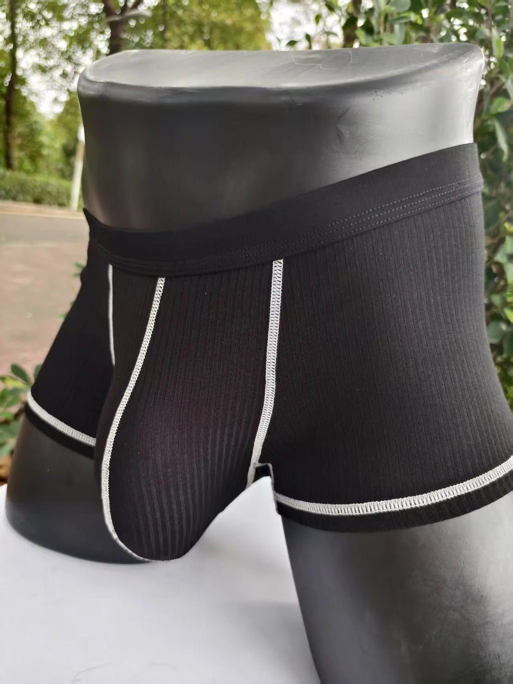 Men's solid colour boxer shorts in Army Green on a white background, showing the breathable fibre fabric.