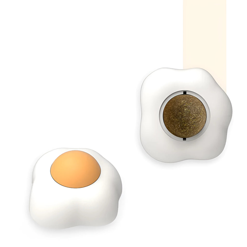 Catnip ball toy in fried egg and poached egg shapes with adhesive backing for wall and floor play