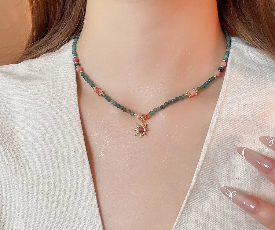 Freshwater pearl necklace with stone sun pendant in blue-sun colour option, court style geometric design