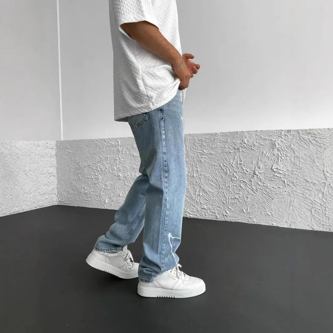 Men's blue straight-leg cotton denim jeans with loose fit and mid-waist design