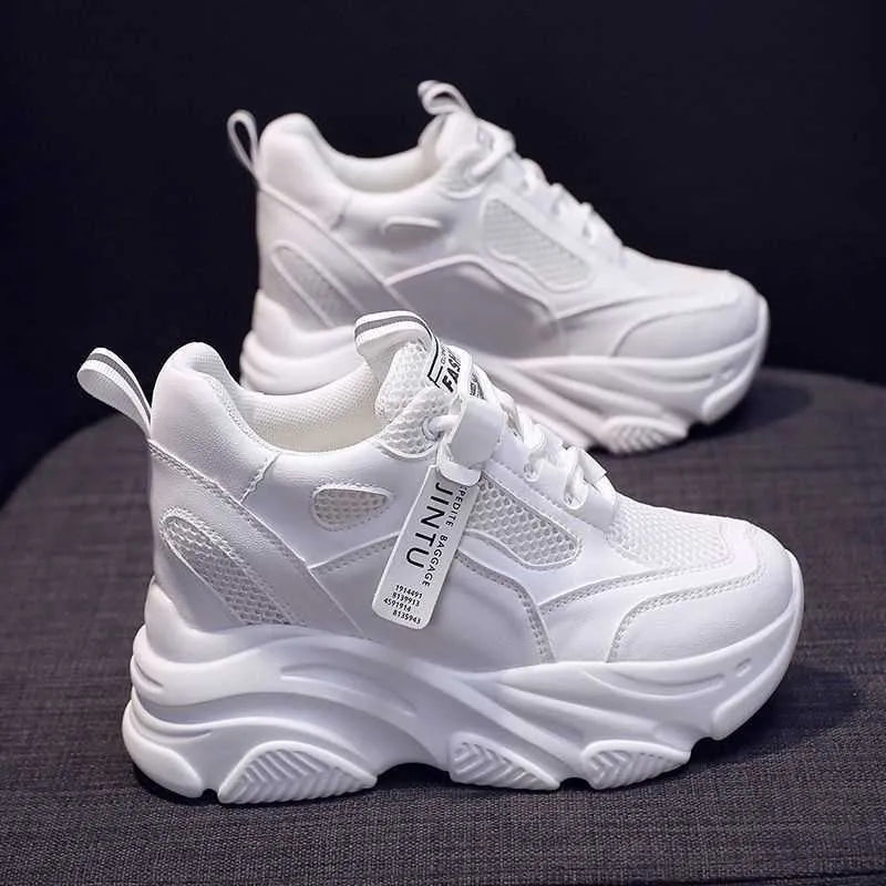 Women's black mesh platform casual shoes with a hollow-out toe holder design on a white background.