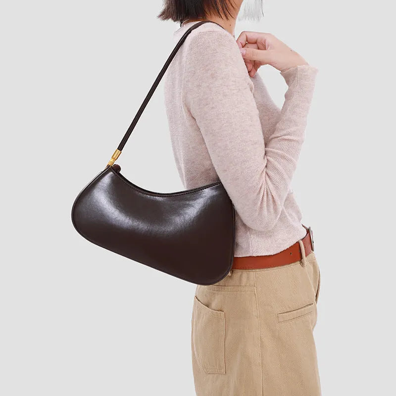 Brown PU leather oval underarm bag with single shoulder strap and sandwich pocket design