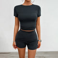 Women's slim solid colour sports suit set with short sleeve top and elastic shorts