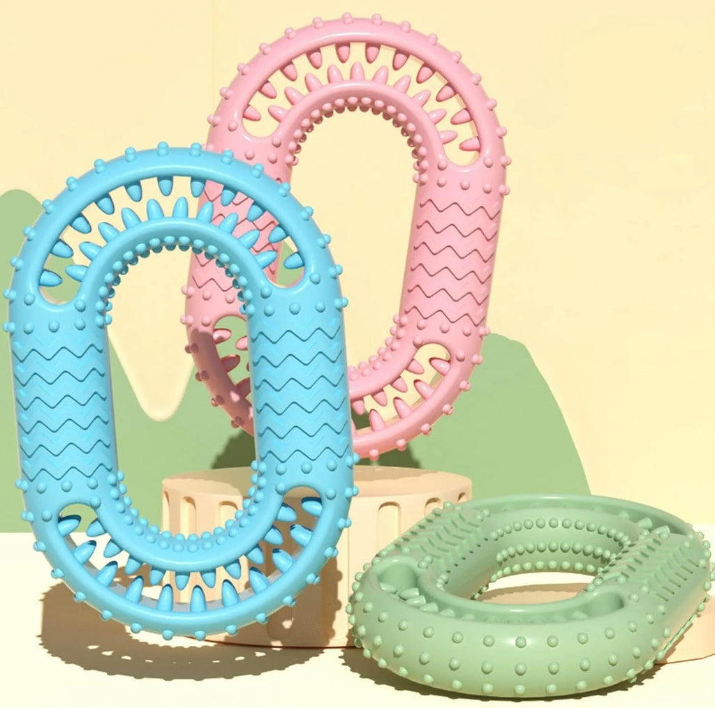 Blue green pink O-ring dog chew toy for aggressive chewers with dental benefits