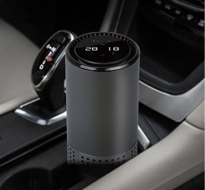 A7 aluminium alloy car air purifier with USB cable, display screen, and water cup design.