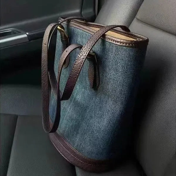 Large denim patchwork retro bucket handbag with a one-shoulder strap.