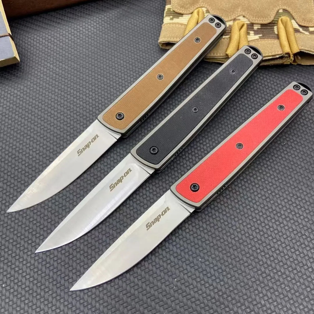 Folding fruit knife with stainless steel blade showing black, coffee colour, and red handle options