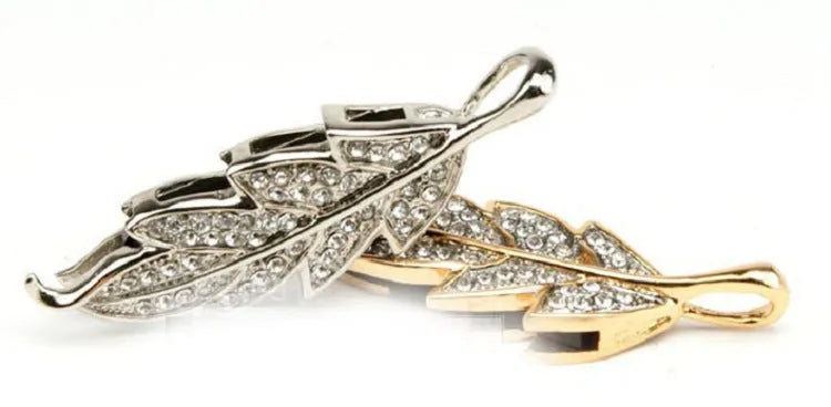 Silver metal USB flash drive with a crystal maple leaf decoration showing front and side views.