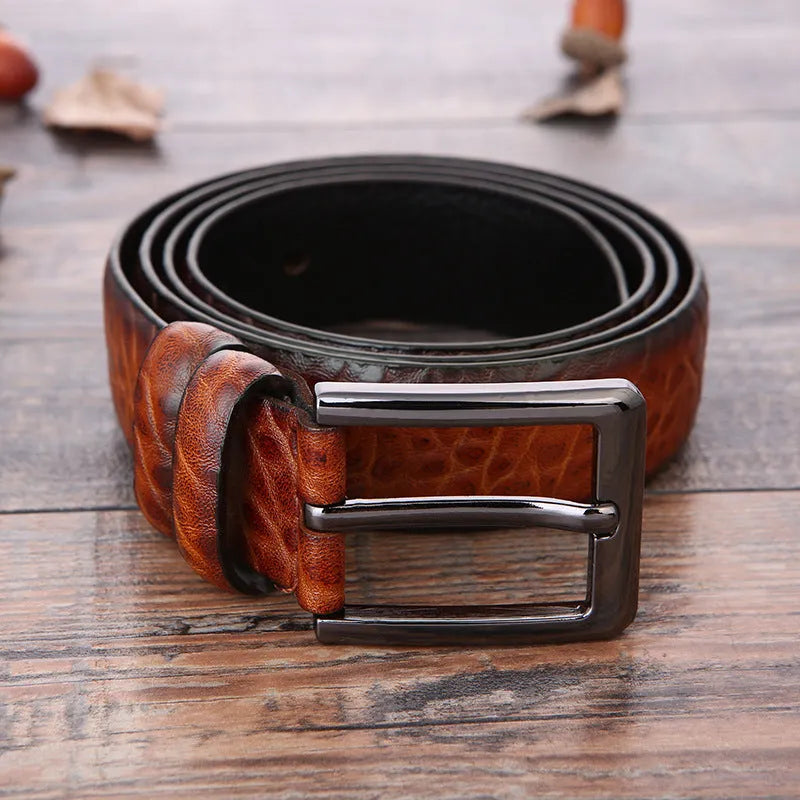 Men's business belt with electroplated alloy buckle showing laser logo pattern detail