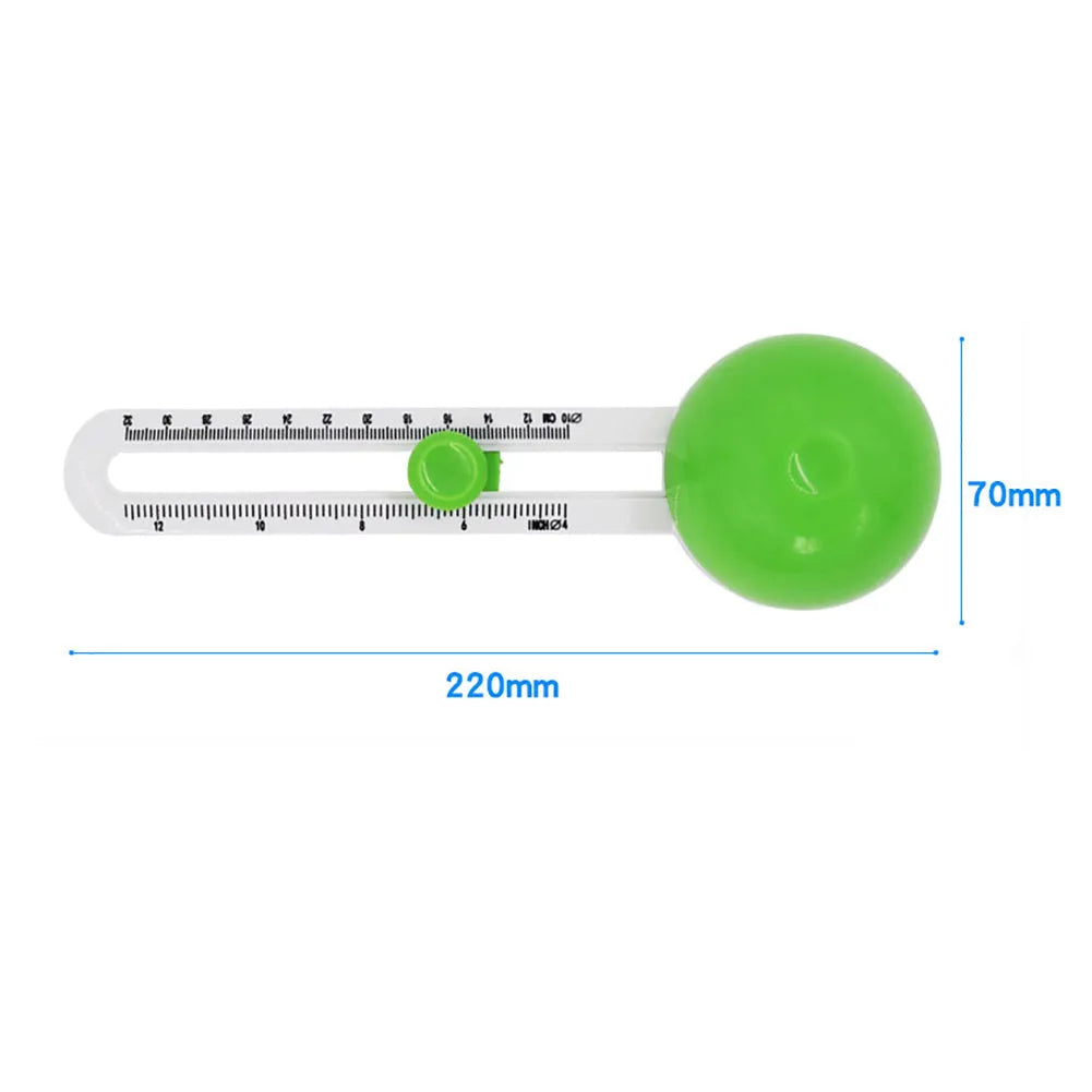 Orange plastic round paper cutter for A3 sheets on a desktop