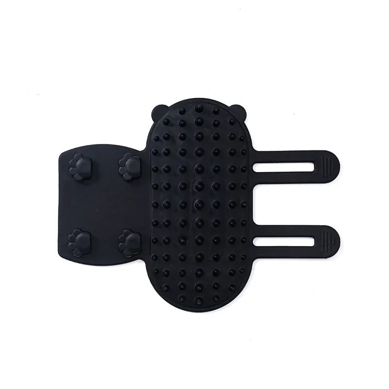 Silicone cat grooming comb scratcher with adjustable strap mounted on a table leg