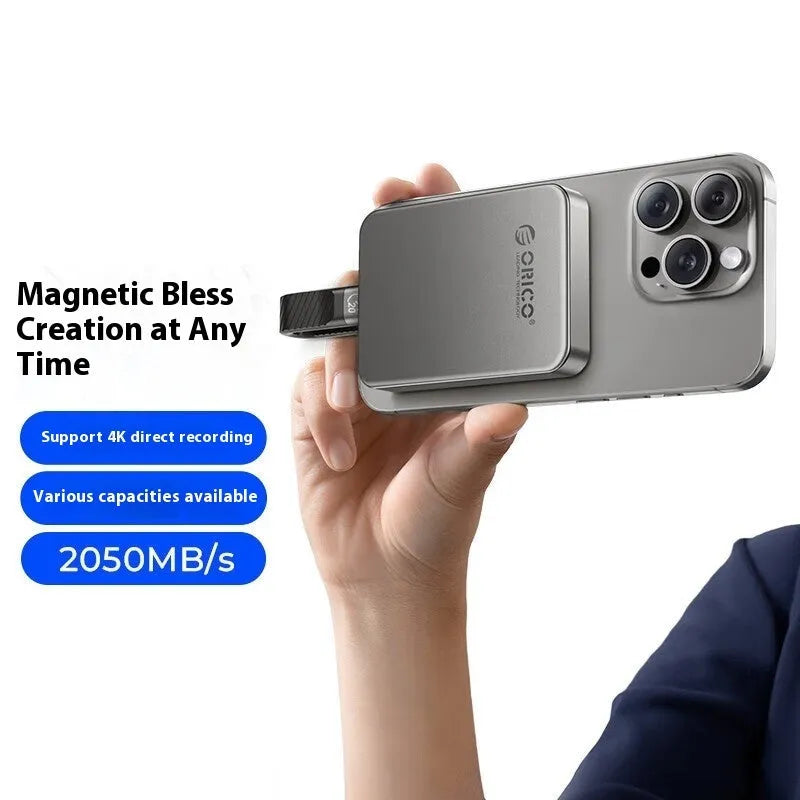 Grey ultra-thin magnetic mobile solid state drive for phones and computers with C to C cable.