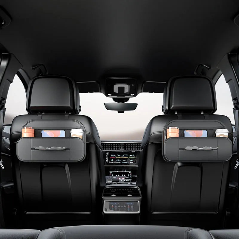 Black leather storage bag attached to the back of a car seat for organisation.