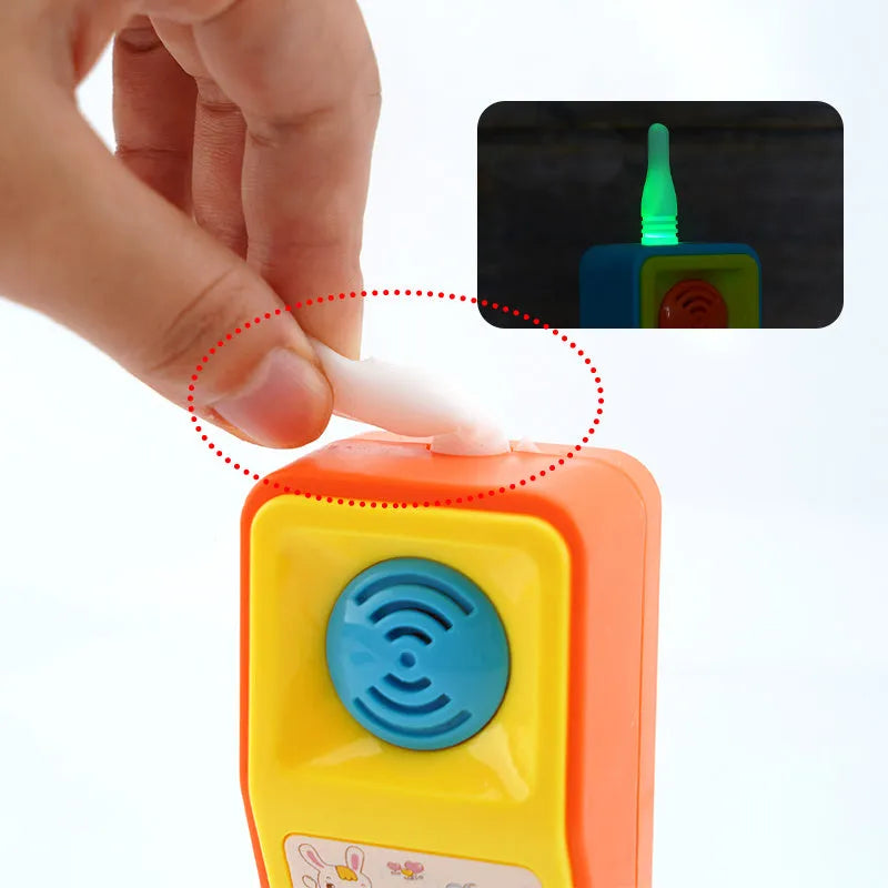 Children's educational toy with sound, light, and music features showing cartoon animal designs