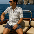 Men's light blue beach set consisting of a short-sleeve shirt and matching elastic shorts on a neutral background.