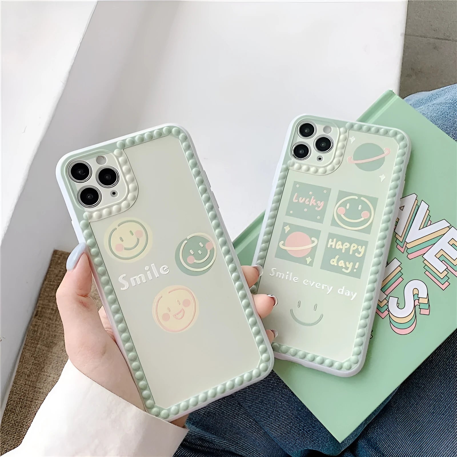 Green TPU iPhone case with geometric pattern and smiley face design in a polka dot frame.